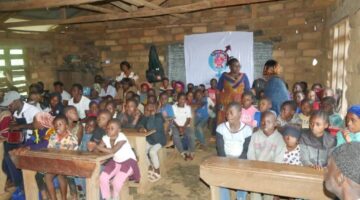 A cross section of double and paternal orphan children, pregnant teenage girls and teenage mothers  with widows and BGG staffs at third day of project implementation in Aletening Village 31/08/2024